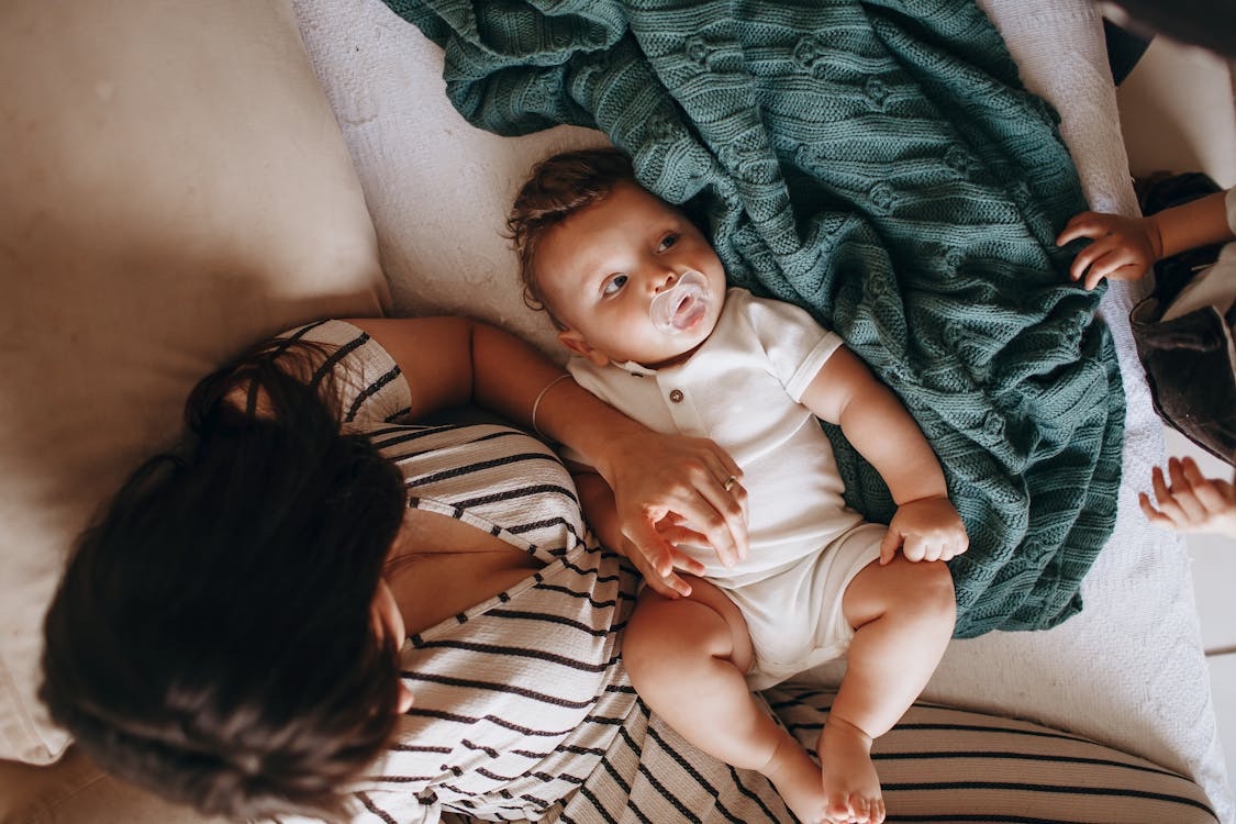 Parent holding a baby at home